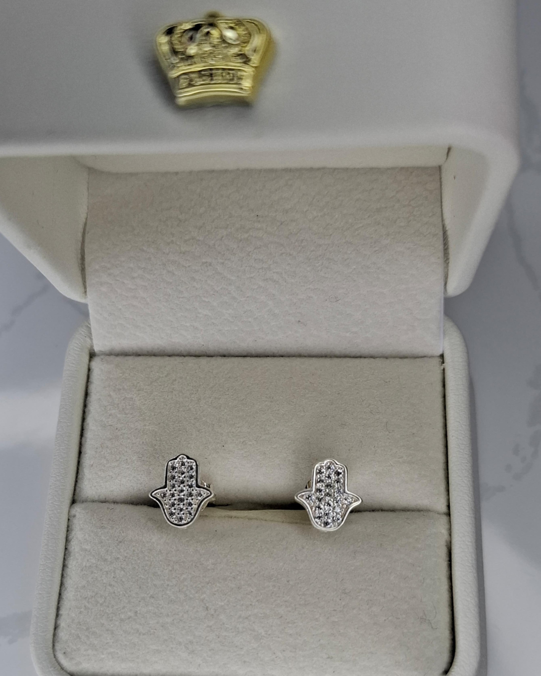 Topos manos de hamsa en plata 925