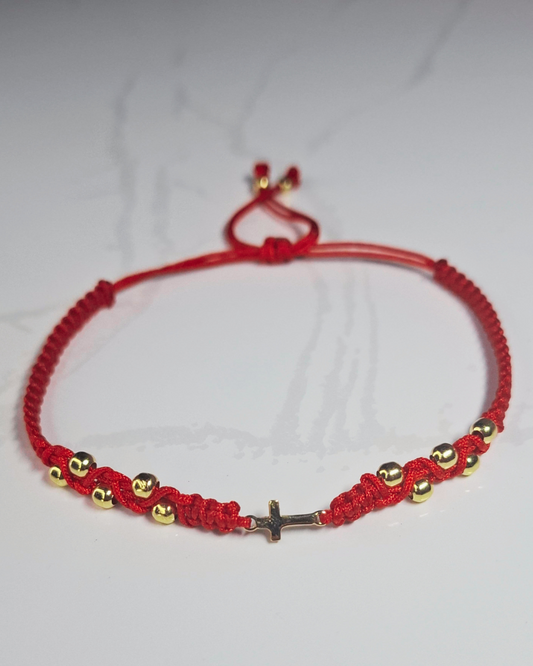 Pulsera tejida 0.75 gr oro 18k herraje cruz pequeña